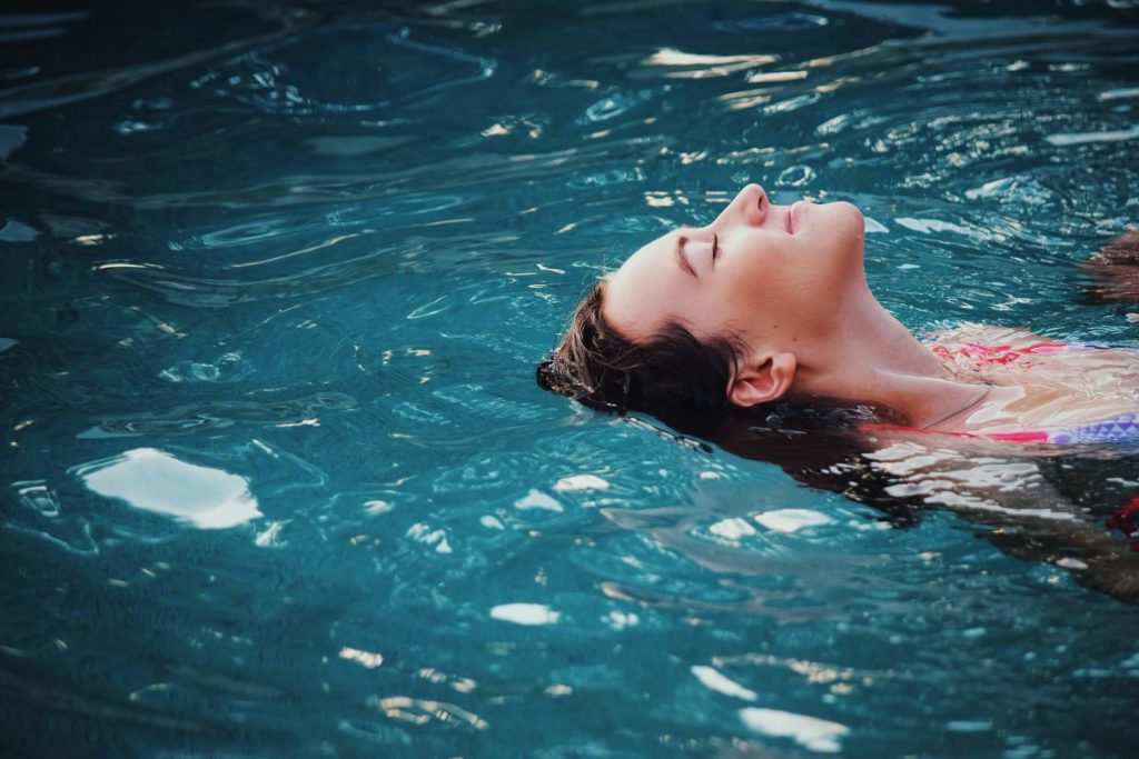 exercise during pregnancy - woman swimming on the back