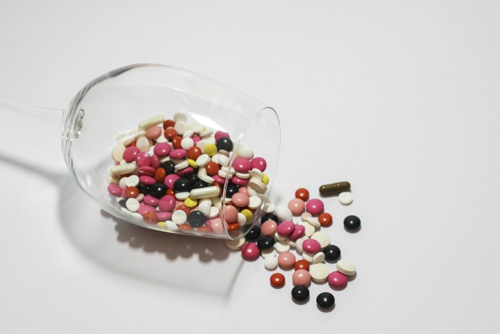 Best supplements for pregnancy - prenatal multivitamins pills in a glass.