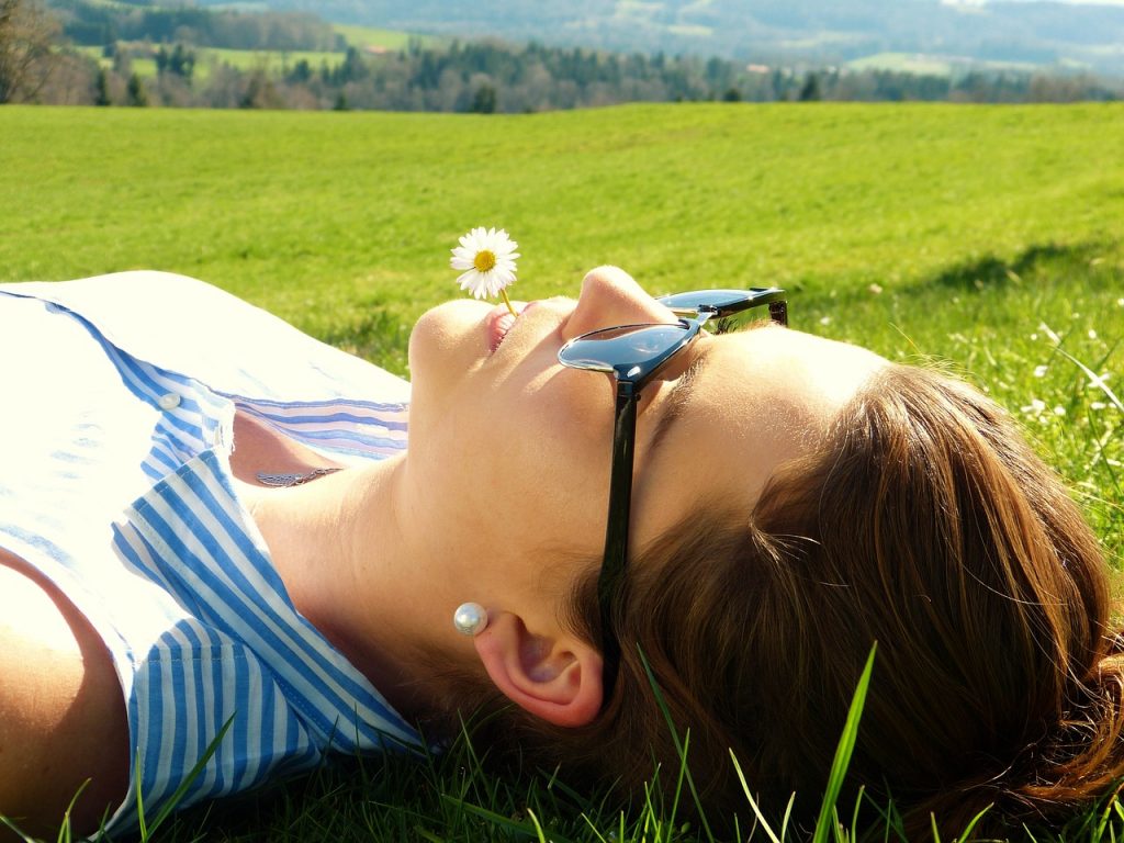 Best supplements for pregnancy - Vitamin D, woman sunbathing.